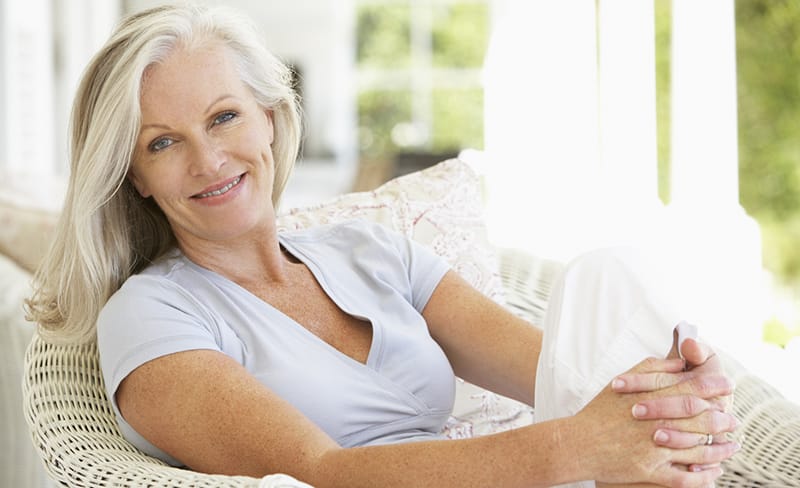 Senior Woman with Dental Crowns in Rochester, NY